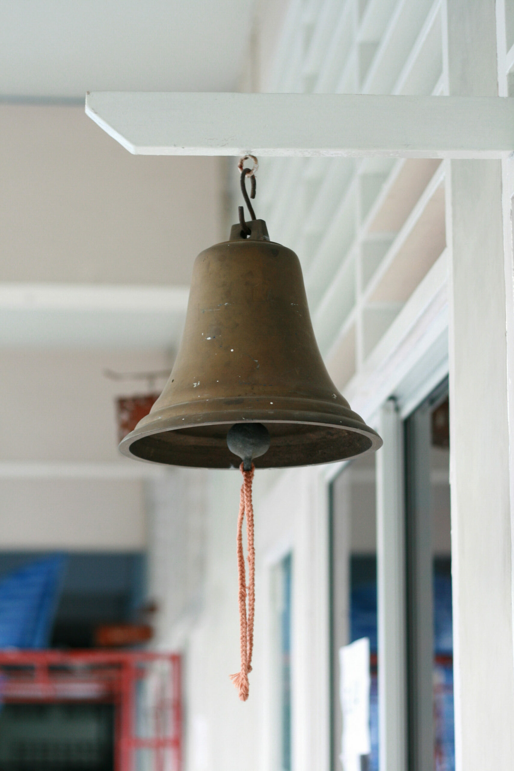 School bell hanging in front of the classroom